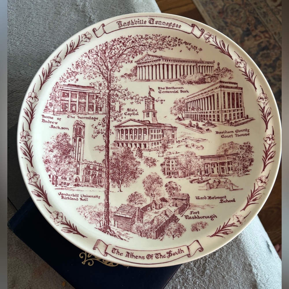 Vintage Nashville,TN souvenir plate by Cain-Sloan Co. The color is cranberry.